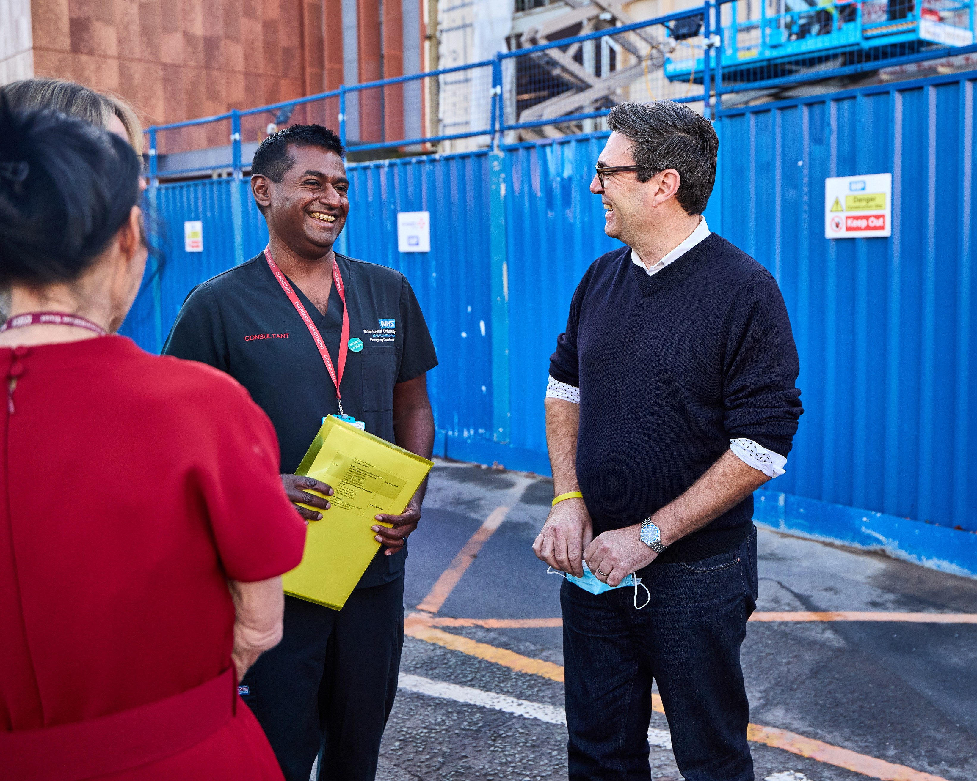 Andy Burnham smiling while talking to Joey Godfrey (ED Consultant at MRI)